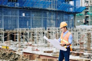 construction engineer with blueprint 930x620 1